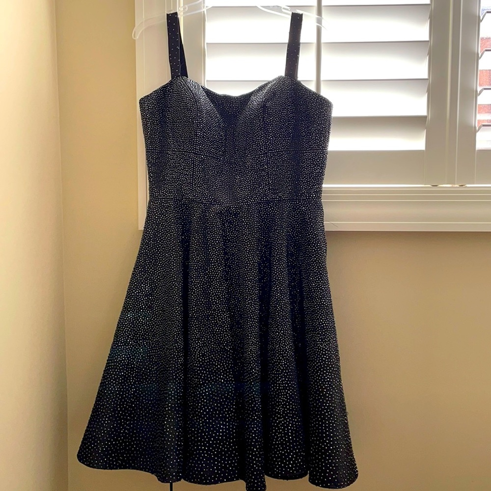 This is a Sherri Hill dress, size 12. It is formal dress, and comes with a mask.